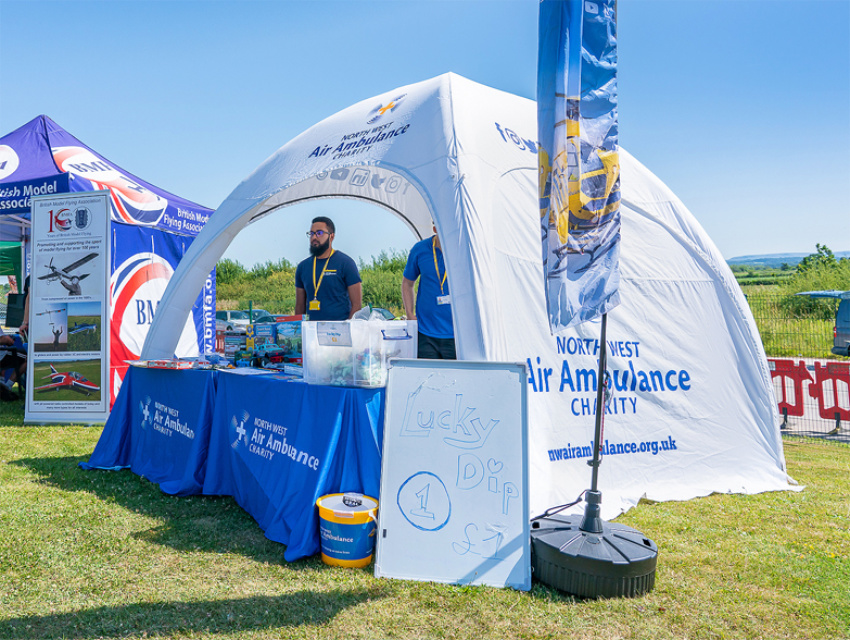 North West Air Ambulance Charity Build a Complete Branded Event Setup with Inflatable Domes and Custom Inflatable Arch