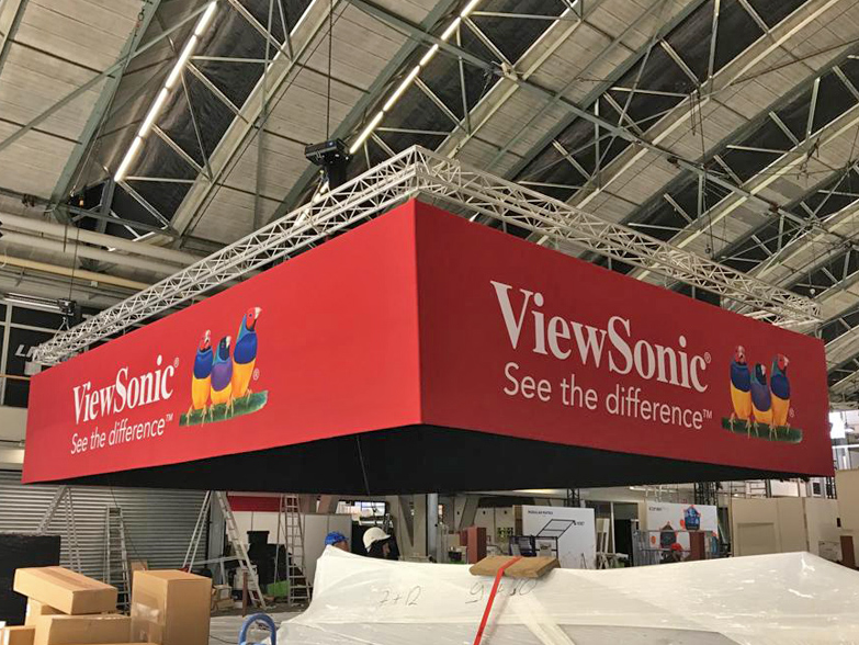 Large printed Hanging Banner being lifted into event space