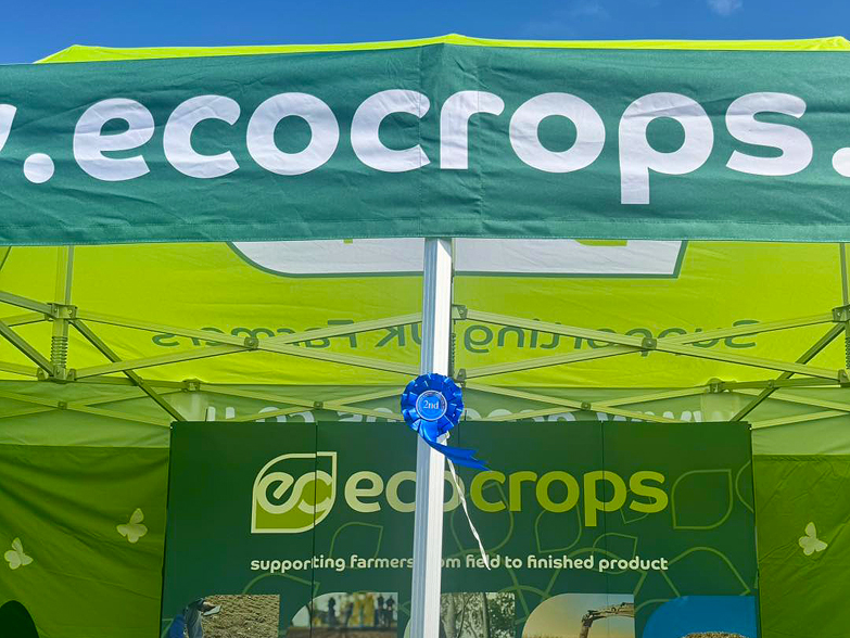 Eco Crops 3x6m branded gazebo with staff at agricultural show
