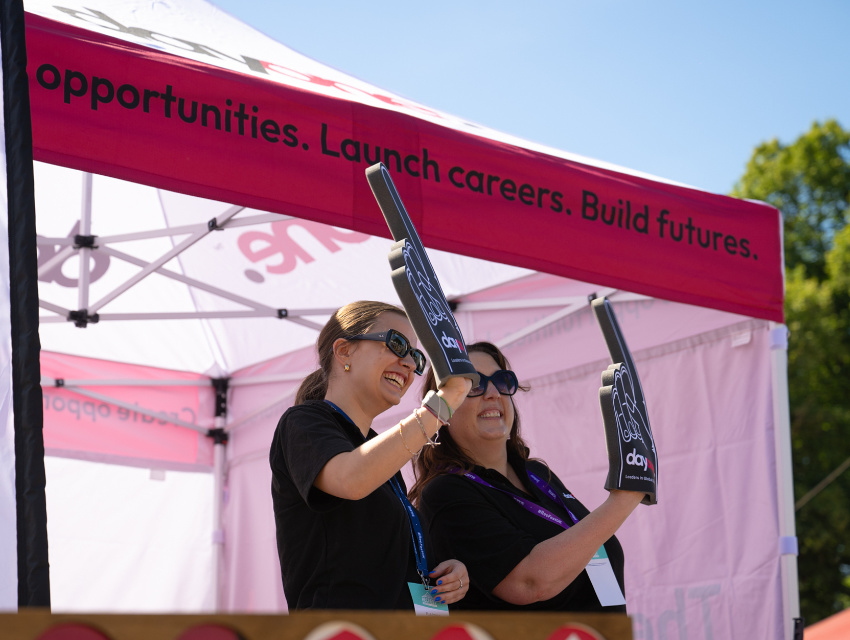 Day One team enjoying RecFest under custom printed Express 40 frame gazebo