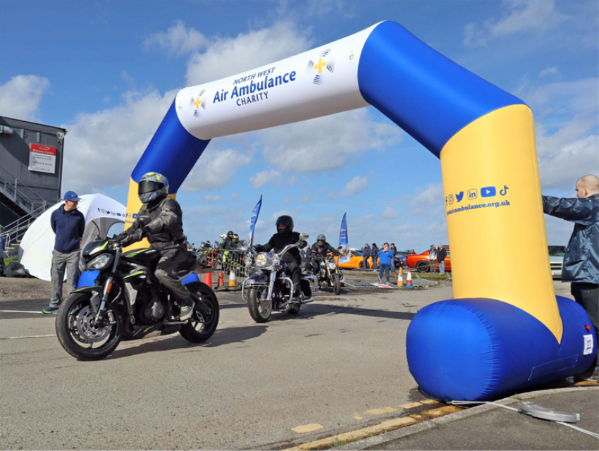 North West Air Ambulance Charity 6m Sealed Air Arch marking the start line at a motorbike event