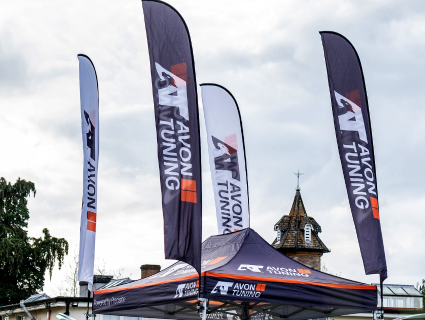 Avon Tuning Hex 50 gazebo with gazebo mounted feather flags providing height and visibility at a motorsport event