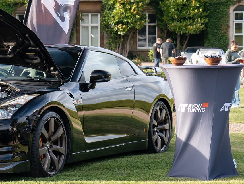 Avon Tuning branded cocktail table used for customer meet and greet at automotive event